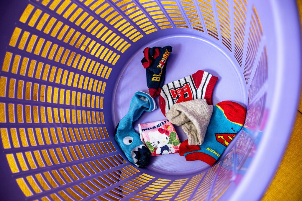 odd socks in laundry basket - underloading your washing machine